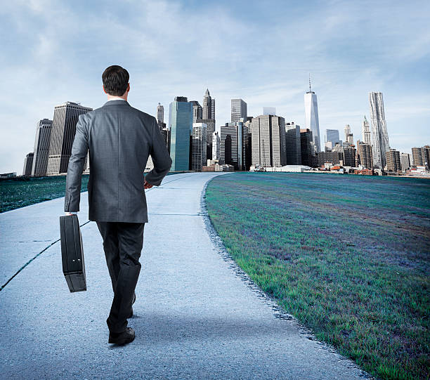 istock Businessman Walking Into The City 532449489