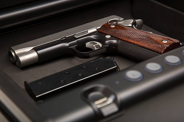 Handgun in Safe Box stock photo