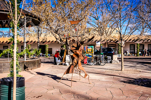 Santa Fe, USA - November 11, 2022. Street view of downtown Santa Fe with people walking on sidewalk, New Mexico, USA
