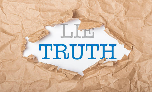 istock Truth and lie words on paper and torn cardbox 532465079