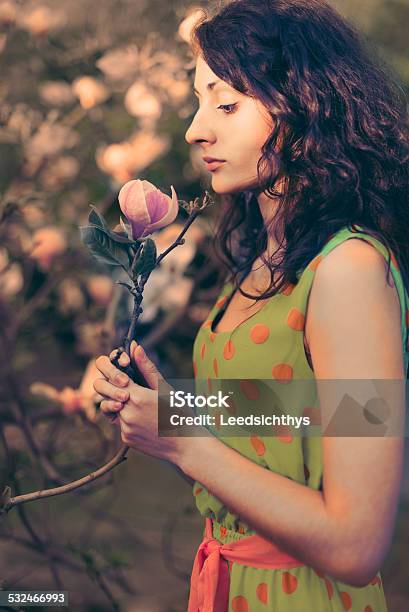 Woman And Magnolia Stock Photo - Download Image Now - Adult, Beautiful People, Beautiful Woman
