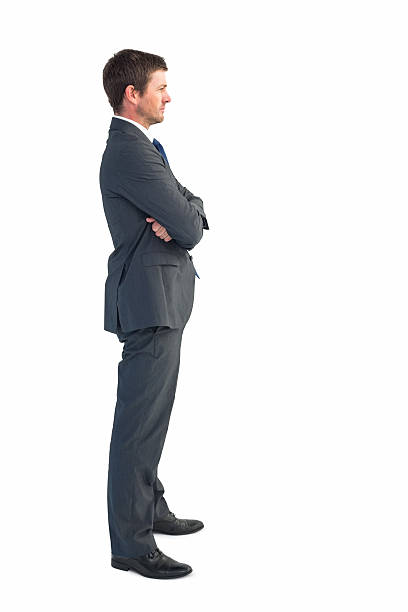 istock Businessman standing with arms crossed 532468315
