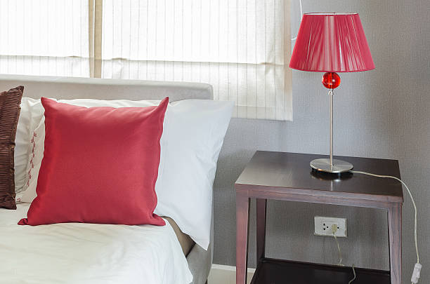 istock bedroom with red pillow and red lamp 532468601