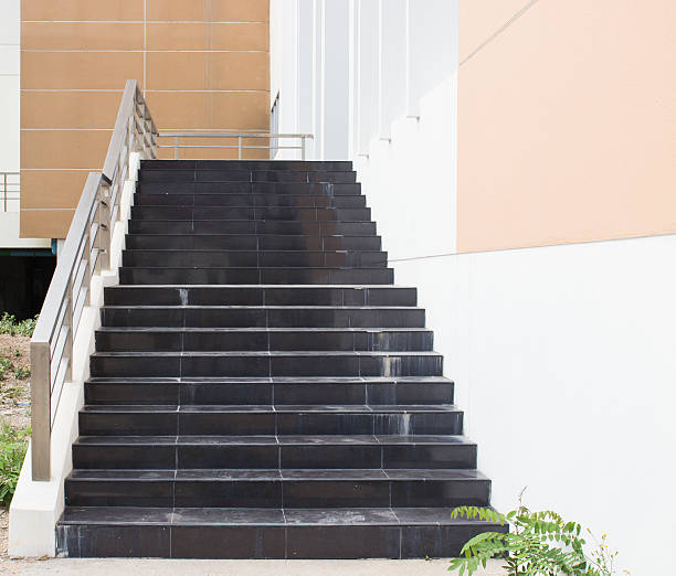 istock modern black stairs and metal handrail 532468735