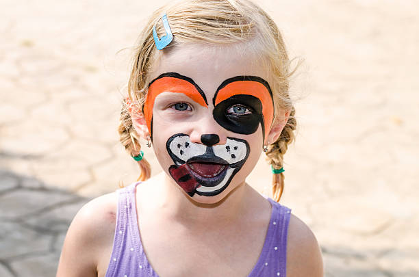 istock girl with face painting 532468917