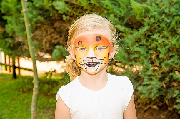 istock girl with tiger face painting 532468923