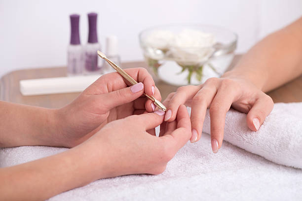 istock client and manicurist in manicure salon 532468965