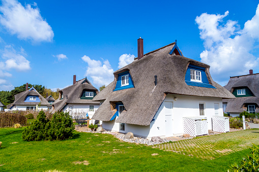 Kampen-Sylt, Germany, June 28 2019: Thatched Roof ( Reetdach ). Typical house with straw roof in small village on Sylt island in  Germany.