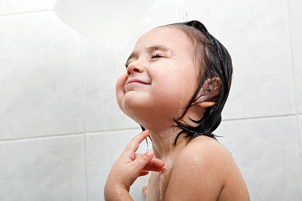Baby in a bathtub stock photo