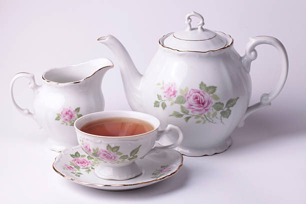 istock Traditional english tea with white tea set floral dishware 532482473