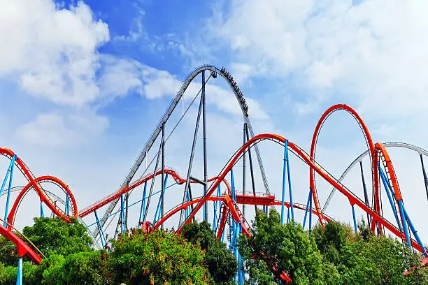 Photo of Roller Coaster in amusement  park.