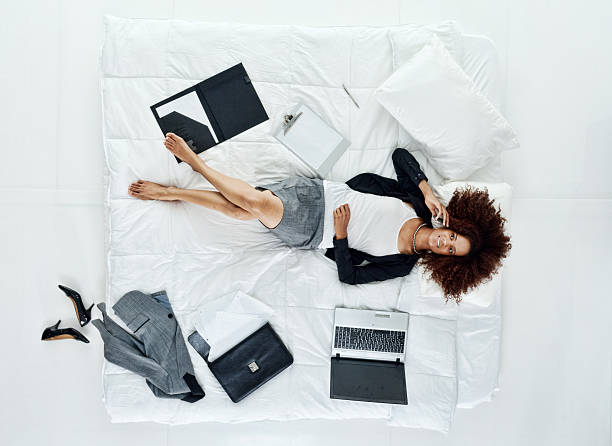 istock Businesswoman lying on bed 532484735