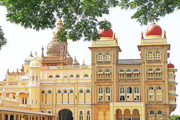 this huge palace and grounds that was built by King Yaduraya inside the Old Fort in Mysore in the 14th century, its been demolished and reconstructed many times. the Maharaja of Mysore Ra jarshi Sri Sir Krishnaraja Wodeyar IV, commissioned the British architect Lord Henry Irwin to build a new palace to replace the old one which had been turned into ashes by fire. Meanwhile, the royal family stayed in t,he nearby Jaganmohan Palace. Construction of this palace was completed in 1912, in 1940 additional structures and a new hall were constructed.only the taj mahal attracts more tourists than this palace
