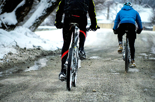 Group of bikers on the road. Group of bikers on the road. Cloudy winter day. Film look image. group of people people recreational pursuit climbing stock pictures, royalty-free photos & images