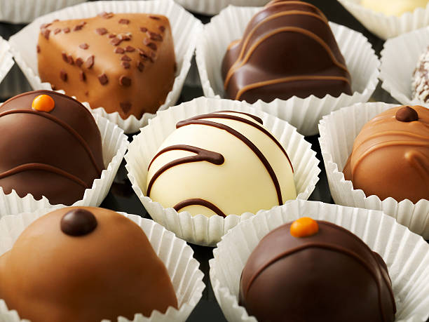 istock close up shot of chocolates in a row. 532507161
