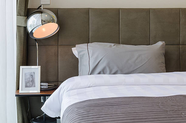 istock grey pillow on bed with lamp 532516767