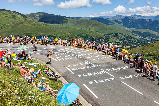 Road of Le Tour de France Col de Peyresourde,France- July 23, 2014: Image of spectators waiting on the roadside for the peloton during the stage 17 of Le Tour de France on 23 July 2014. tour de france stock pictures, royalty-free photos & images