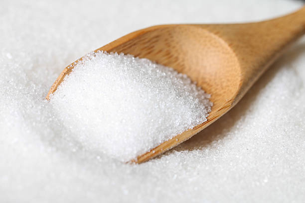 istock sugar in a wooden spoon 532518171