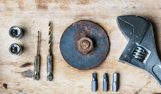 Pliers Drill, screwdriver and nut on a wooden floor. Pliers Drill, screwdriver and nut on a wooden floor. knurl stock pictures, royalty-free photos & images