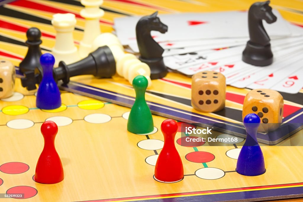 Closeup of board games Photo shows a closeup of a various board games including chess and cards. 2015 Stock Photo