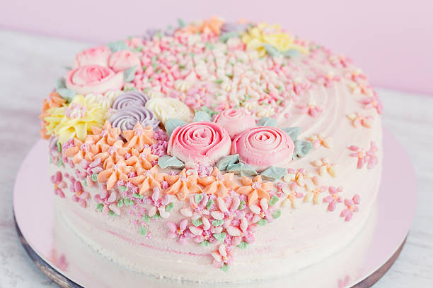 istock Pastel pink cake decorated with cream flowers 532519977