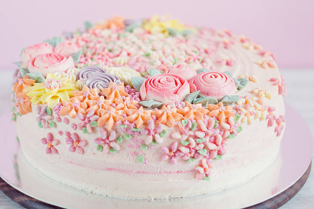 istock Pastel pink cake decorated with cream flowers 532519979