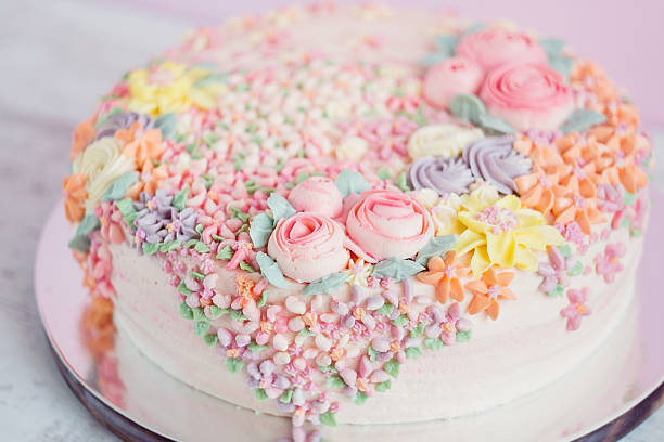 istock Pastel pink cake decorated with cream flowers 532519981