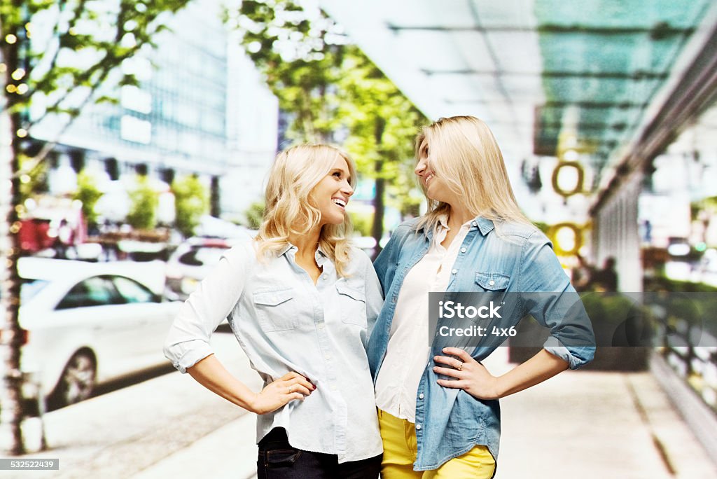 Two women out in the city standing Two women out in the city standinghttp://www.twodozendesign.info/i/1.png 20-24 Years Stock Photo