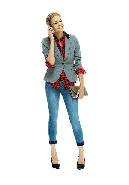 istock Cheerful woman on mobile & holding purse 532523321
