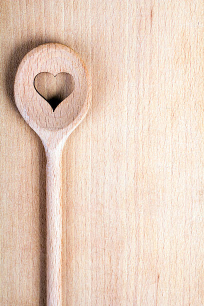 istock Heart hole spoon on the wooden pastry board 532523481