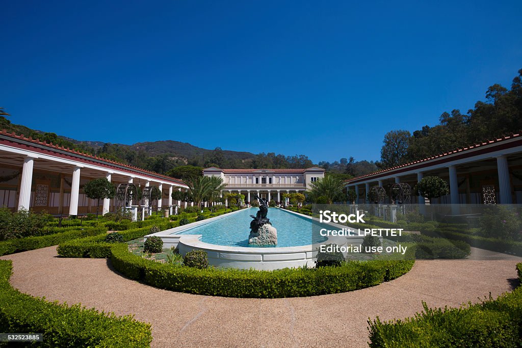 Getty Villa Malibu, USA - September 5, 2008: A view inside the Getty Villa in Malibu, California. The Getty Villa in the Pacific Palisades neighborhood of Los Angeles, California, USA, is one of two locations of the J. Paul Getty Museum. The Getty Villa is an educational center and museum dedicated to the study of the arts and cultures of ancient Greece, Rome, and Etruria. The collection has 44,000 Greek, Roman, and Etruscan antiquities dating from 6,500 BC to 400 AD, including the Lansdowne Heracles and the Victorious Youth. The UCLA/Getty Master’s Program in Archaeological and Ethnographic Conservation is housed on this campus. The collection is documented and presented through the online GettyGuide as well as through audio tours. Getty Villa Stock Photo