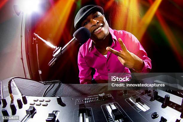 Black Male Dj Playing Music At A Nightclub Party Stock Photo - Download Image Now - 2015, Adult, African Ethnicity