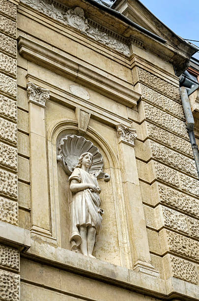 istock Ancient building from 1891 year with young woman statue 532529155