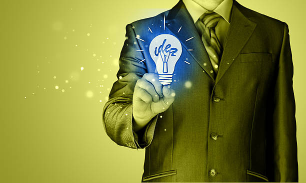 istock Business man touching light of idea 532529519