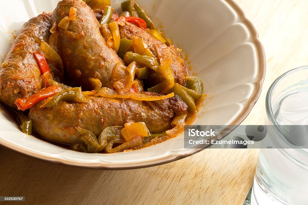 Sausage Onions and Peppers Spicy Italian sausage onion and bell peppers in a bowl 2015 Stock Photo