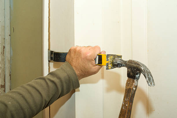 Removing Door Frame Removing an old door frame during a remodel. wack stock pictures, royalty-free photos & images