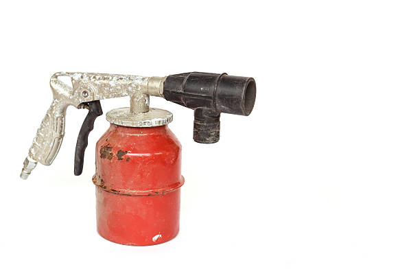 istock Old paint spray gun isolated on white background 532531597