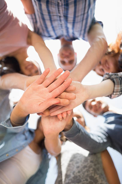istock Happy students putting their hands together 532534747
