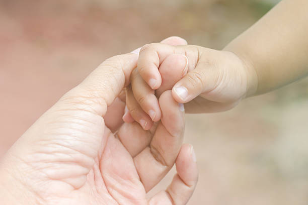 istock New born baby hand 532545936