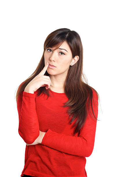 istock Girl in red with thinking hand gesture 532546917