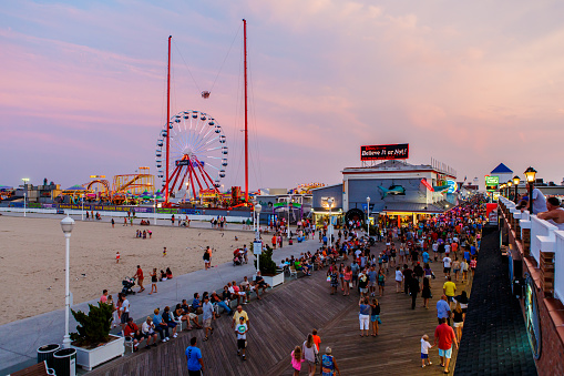 Ocean City, USA - August 4, 2014: Crowded boardwalk in Ocean City, MD on August 4, 2014. National Geographic named it one of the top 10 boardwalks in USA and The Travel Channel called it America's best.