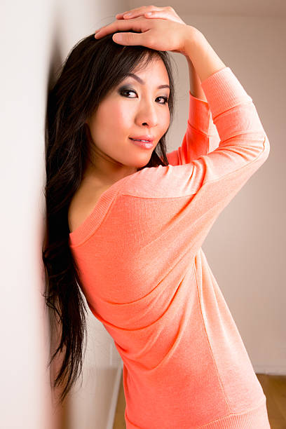 istock Beautiful asian woman leaning on wall 532547521