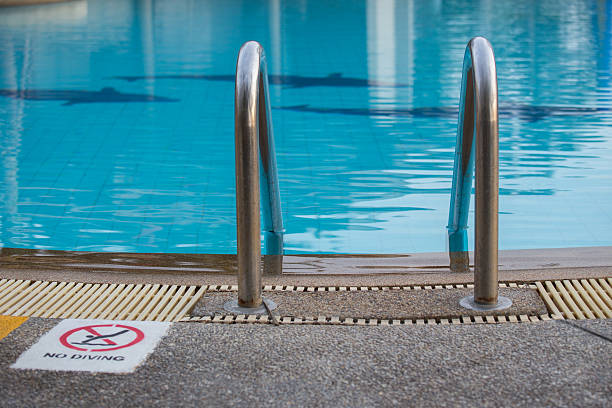 istock swimming pool with  ladder and sign 532547824
