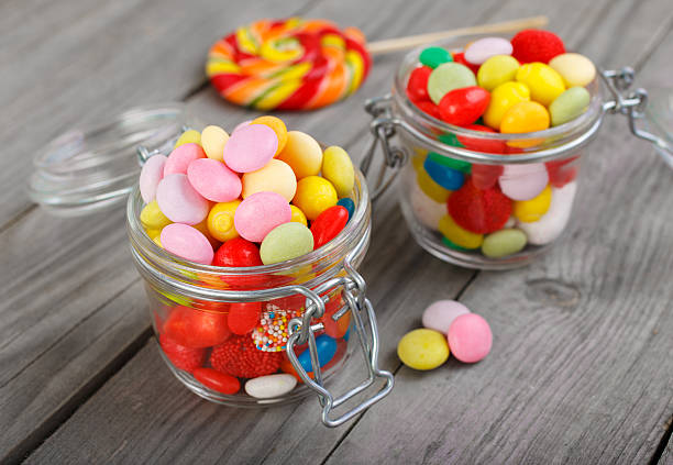 istock Two glass jars of colorful candy 532547948