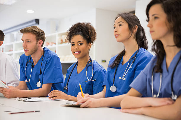 istock Medical student smiling at the camera during class 532548481