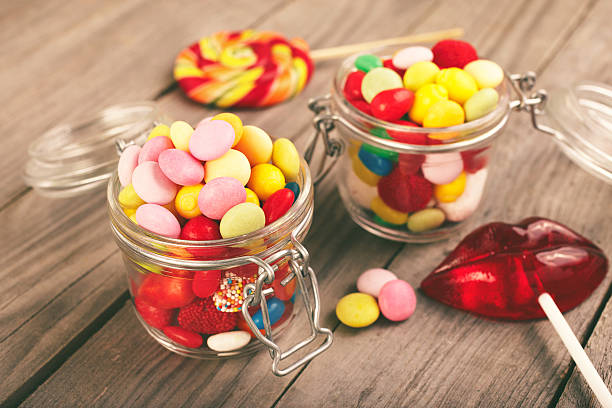 istock Two glass jars of colorful candy 532548526