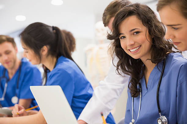 istock Medical student smiling at the camera during class 532548539