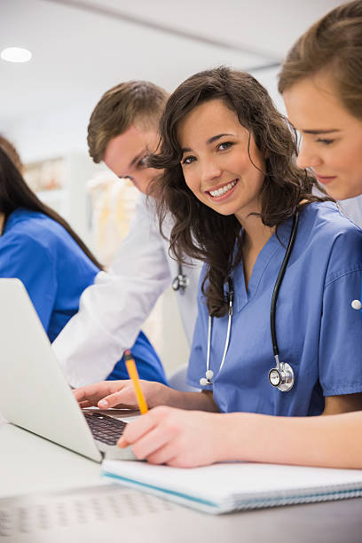 istock Medical student smiling at the camera during class 532548541