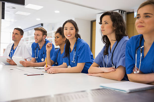 istock Medical student smiling at the camera during class 532548571