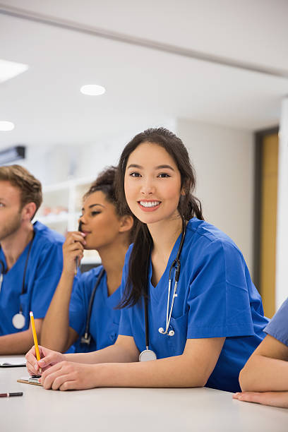 istock Medical student smiling at the camera during class 532548579